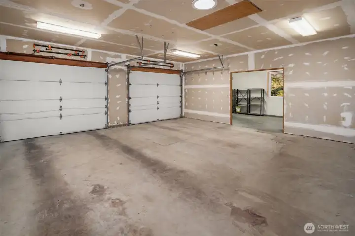 2 car garage with additional space for storage/woodshop
