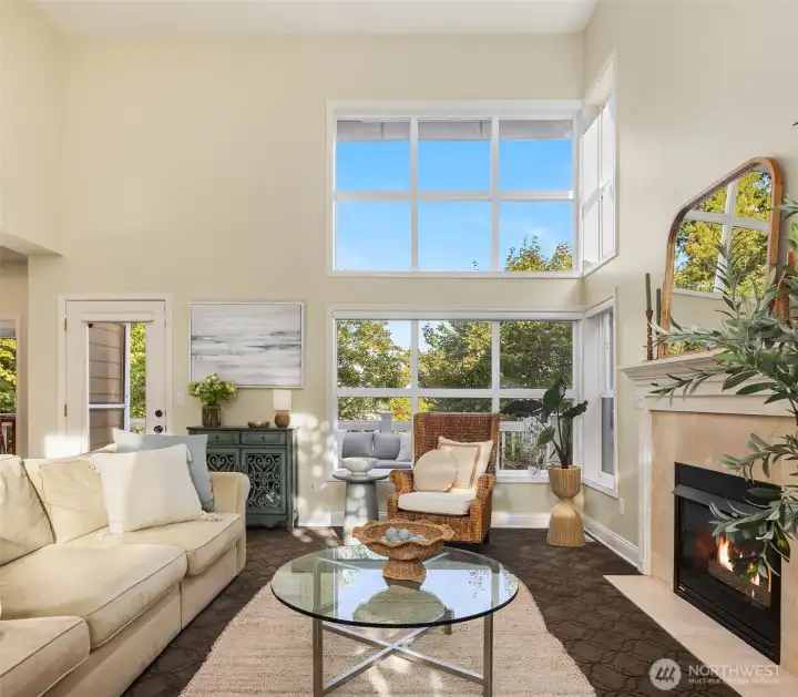 This home's great room affords 20ft ceilings, showcasing an entire wall of windows - many of those window panes were just replaced.