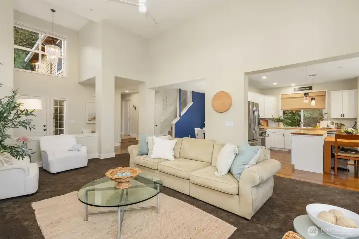 Main living room looking into the open kitchen. The floorplan is open and yet functional.