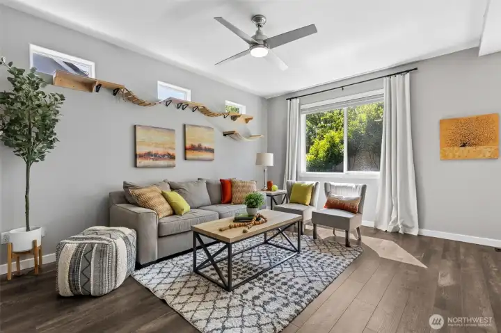 Light pours in through the large backyard window, carrying across the living space and into the dining area, where that high horizontal window does something very smart, it brings in sunlight while leaving your walls fully usable for a buffet, console, or whatever you need. The staircase is right there, leading up to the oversized bonus room, adding that extra layer of flexibility to the home’s 2,157 square feet. Light pours in through the large backyard window, carrying across the living space and into the dining area, where that high horizontal window does something very smart, it brings in sunlight while leaving your walls fully usable for a buffet, console, or whatever you need. The staircase is right there, leading up to the oversized bonus room, adding that extra layer of flexibility to the home’s 2,157 square feet.