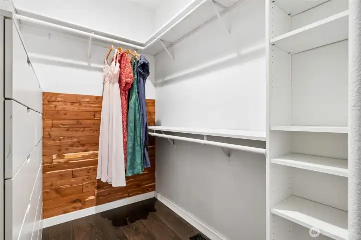 Primary closet made custom. Solid wood built-ins run the show here with a mix of shelving and drawer storage that feels more like furniture than utility. It’s structured, polished, and a serious upgrade from the typical wire system. Everything is within reach, everything looks good, and nothing feels temporary.