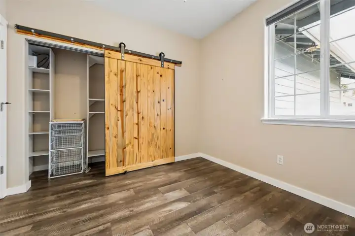 Built-in shelving inside the closet means everything has a place from day one, no extra systems needed. The sliding barn door in that warm wood plank finish adds just enough contrast against the soft tones and white flooring running throughout the home. It’s clean, simple, and quietly stylish. And then you zoom out and realize the location is doing its own heavy lifting. Zoned for North Thurston Public Schools, with attendance options including Olympic View Elementary School, Salish Middle School, and River Ridge High School. Plus Aspire Middle School, a unique public middle school that uses a lottery system and centers its program around the arts, creative expression, and project-based learning. It’s one of those unexpected extras that gives this home an edge beyond the walls.