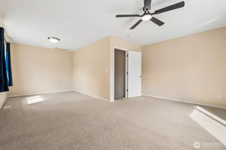 This massive 23 by 16 bonus room feels like its own private zone, completely separate from the rest of the home. Guest suite, movie lounge, creative studio, full-on teen takeover, it can handle all of it without breaking a sweat. The deep closet adds real storage, not the kind you have to fight with, and the ceiling fan keeps the air moving when things heat up. The plush carpeting softens the space and keeps sound in check, which suddenly makes late nights, early mornings, and everything in between a lot more manageable. Big enough to function like a studio-style setup, flexible enough to change with you over time, this is the kind of space people don’t expect and then immediately start planning around.