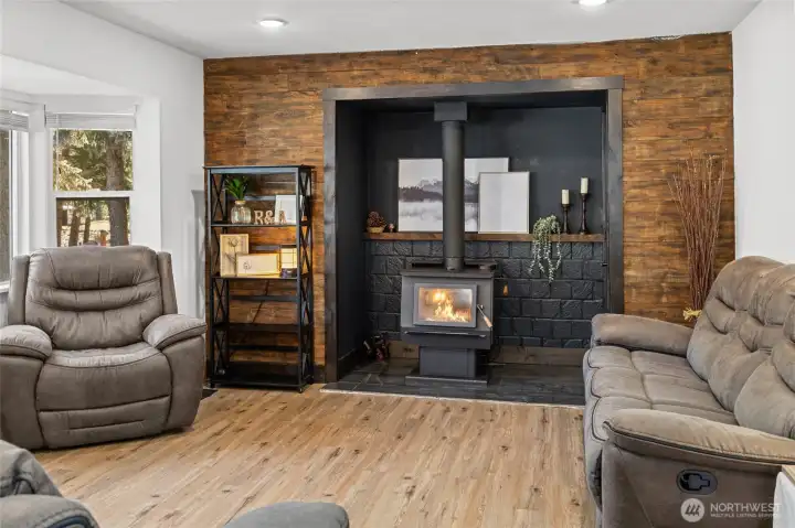 Don't miss the door to the right of the fireplace that leads directly out to the wood shed!