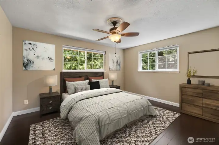 Virtually staged primary bedroom on the main floor