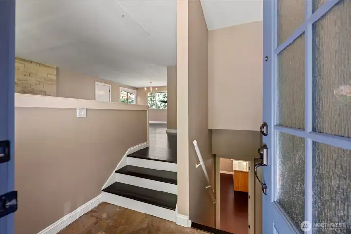 Entry foyer. There are 3 stairs to the main level. Let's go downstairs to the daylight basement...