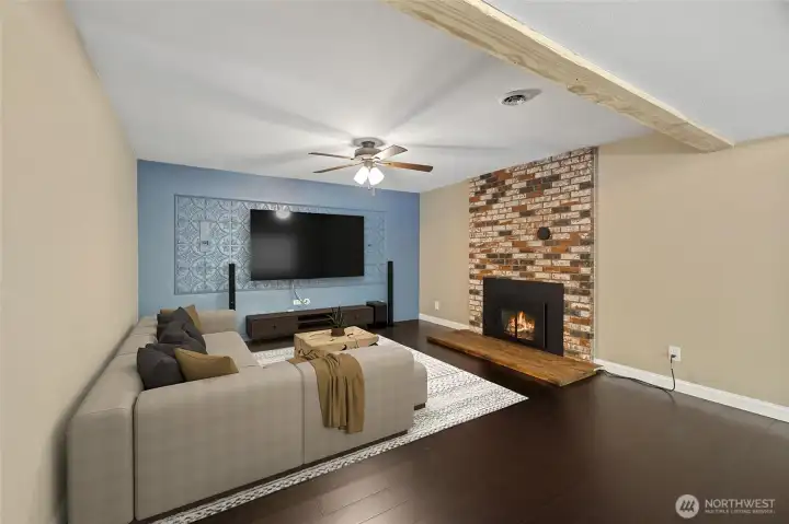 Downstairs media/living room. Virtually staged