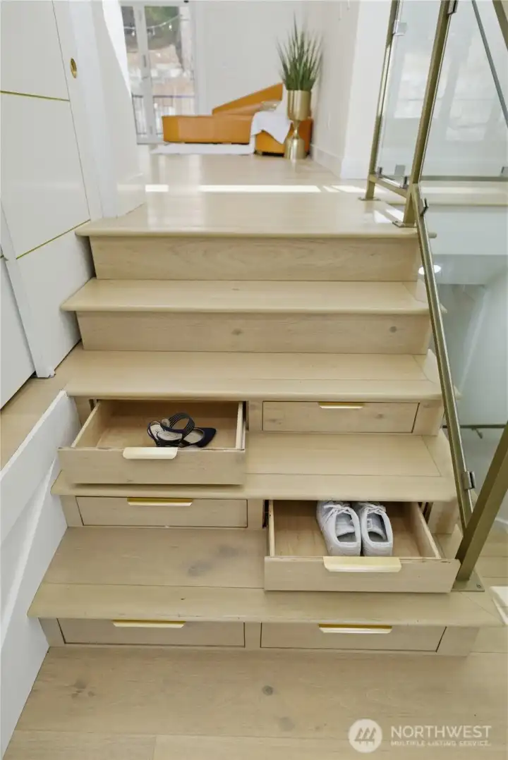 Hidden shoe storage under the stairs Hidden shoe storage under the stairs