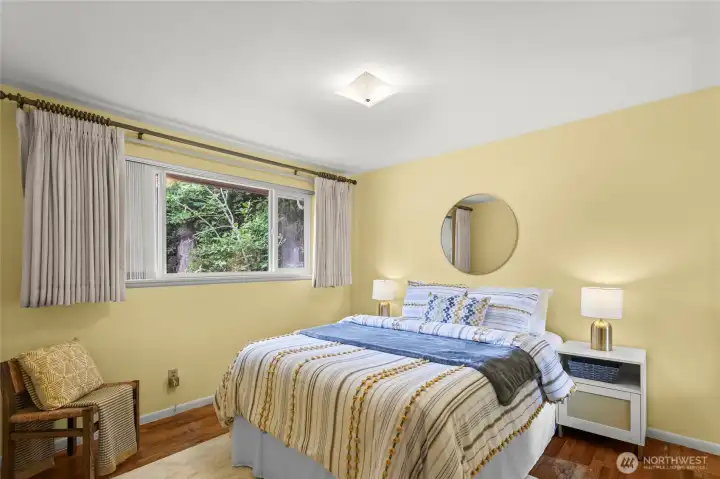Primary bedroom with wood floors Primary bedroom with wood floors