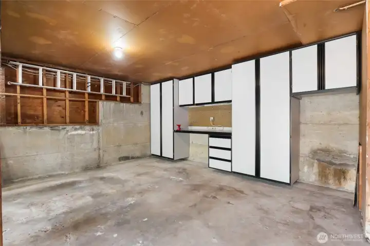 at the end of the 590 sq.ft. two car garage, is a built-in workshop. at the end of the 590 sq.ft. two car garage, is a built-in workshop.