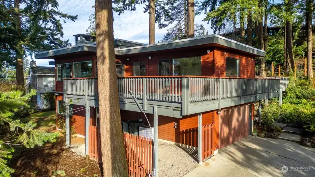 Home with surrounding decks. Top of driveway (not too steep).