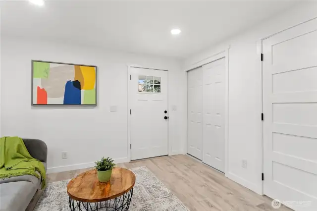 As you walk in looking at entrance, with closet