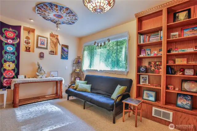 downstairs bedroom with two closets currently used as home office / studio