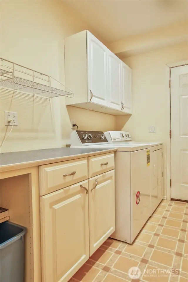 laundry room / mud room with door to back yard
