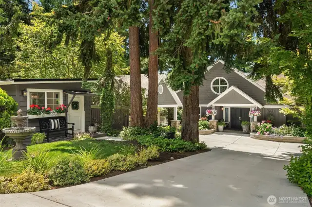 This home makes a striking first impression! A gorgeous main house, carport, and detached office sit in front.