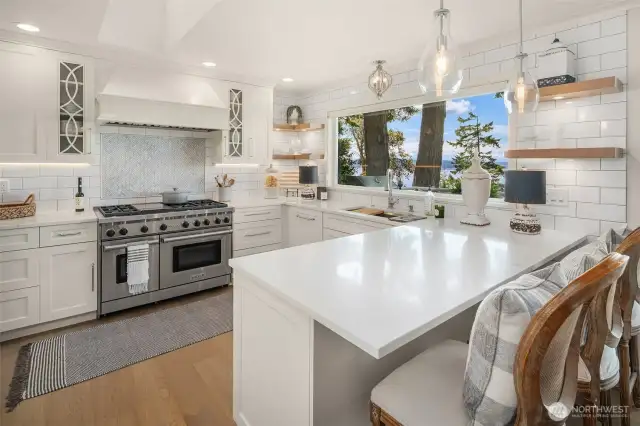 Beautifully renovated kitchen with Wolf range, and integrated dishwasher and Sub Zero refrigerator.