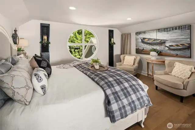The upstairs loft. The circular window adds so much charm.
