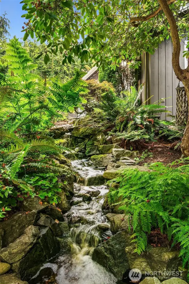 The circulating water feature and small pond add a beautiful noise to the garden.