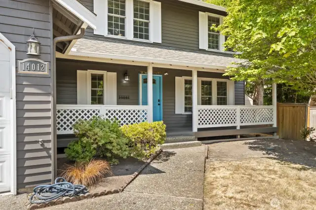 A charming covered porch entry leads you into the fantastically functional main level.