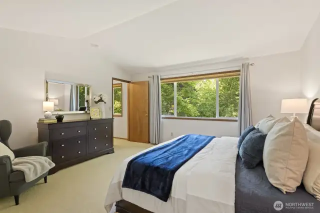 Vaulted ceilings and a large picture window keep this space feeling bright and airy.
