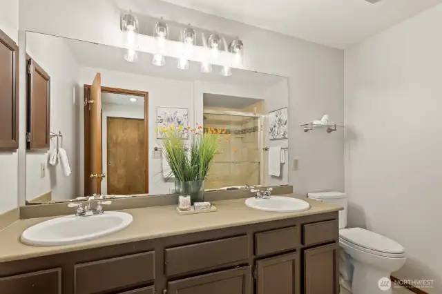 Dual vanities in the primary bathroom make getting ready everyday a breeze.