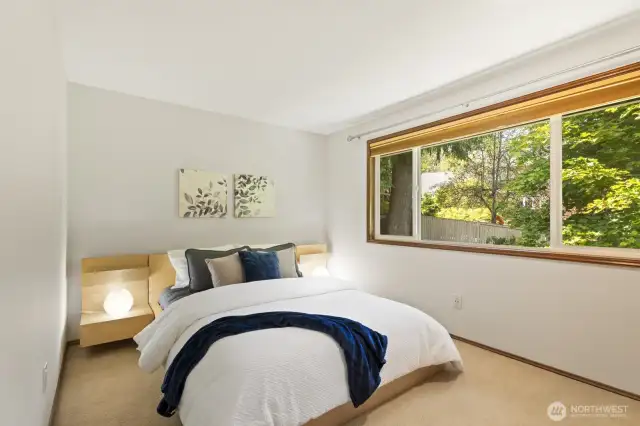 Second upstairs bedroom, looking out to serene treed views.