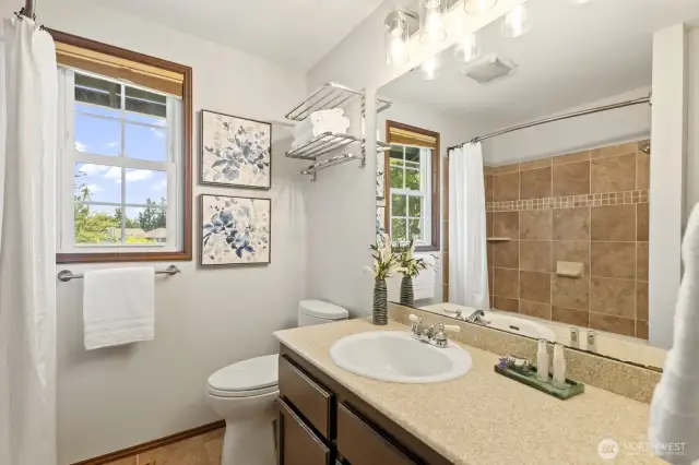 Full bath off of the upstairs hallway.