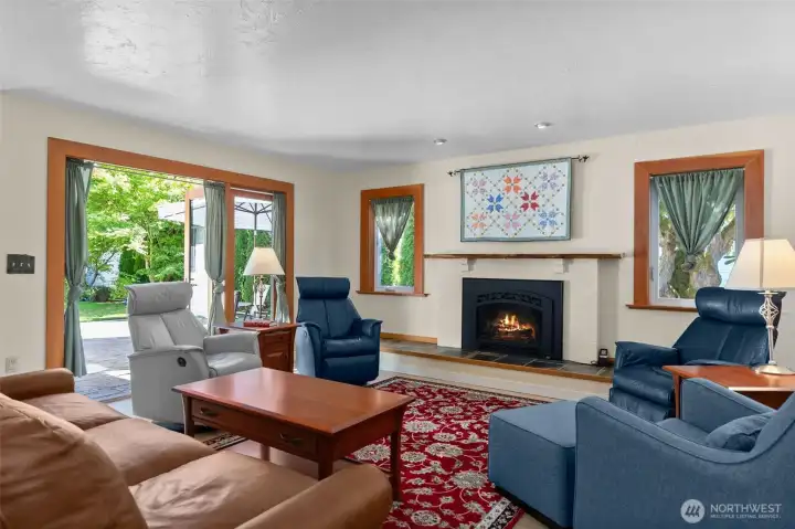 Gorgeous wood wrapped windows and french doors, which open to the beautiful outdoor living space and yard!