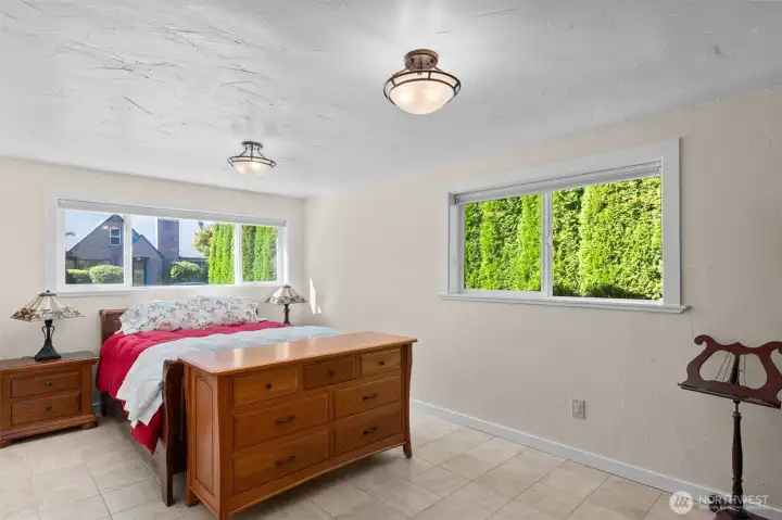 Front office is currently used as guest and music room; it is spacious, offering two large windows with top-down/bottom-up blinds for premium light and uncompromised privacy.