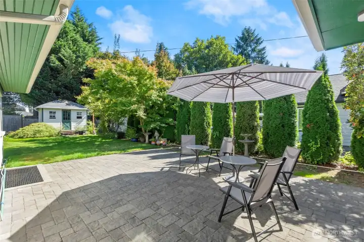 From the french doors in the living and dining rooms, the patio stretches out with room for relaxing, dining, and hosting.