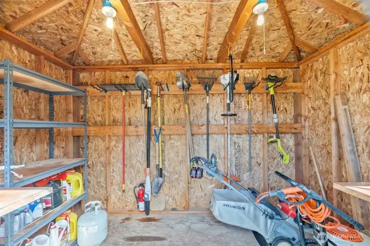 Interior of shed is clean and dry, with electricity.