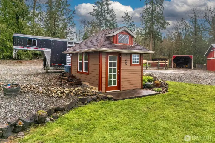 Small garden shed for extra storage and tools.