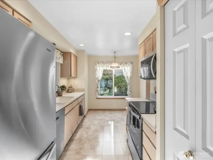 Kitchen features brand new stainless steel appliances and abundant cabinet space