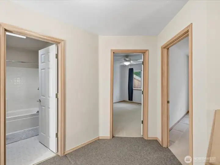 View from the top of the stairs looking towards the guest bathroom & bedrooms 1 & 2