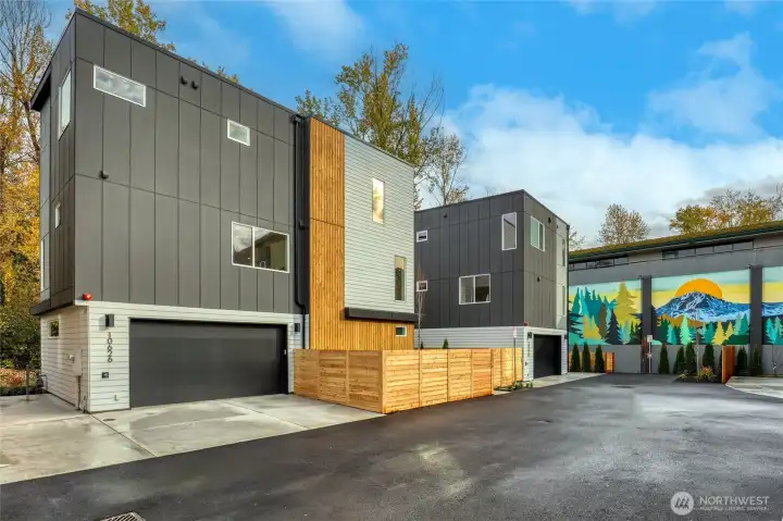 Two-bay EV ready garage, and fenced front yard.