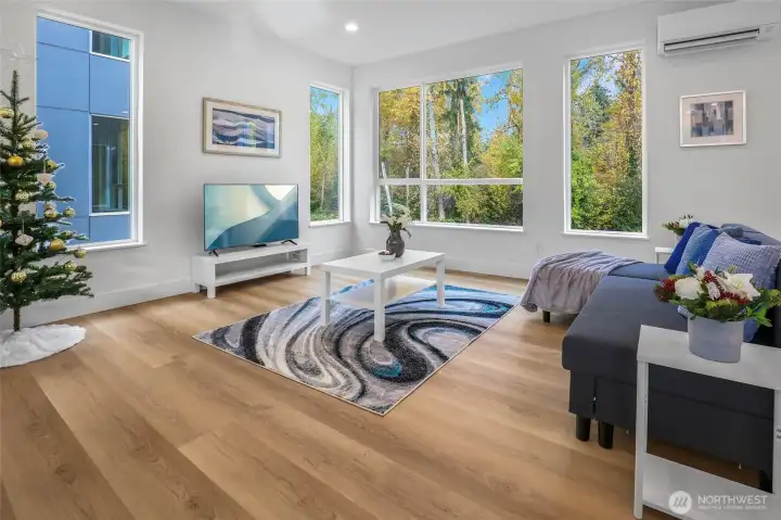 Spacious great room with greenbelt views.