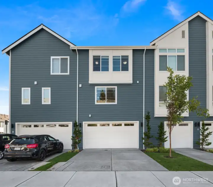 Rare 2 car-garage + 2 car-driveway parking sets this home apart from the other townhomes!