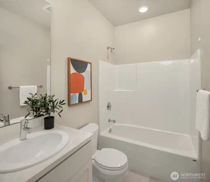 Lower level full bath as part of guest suite.