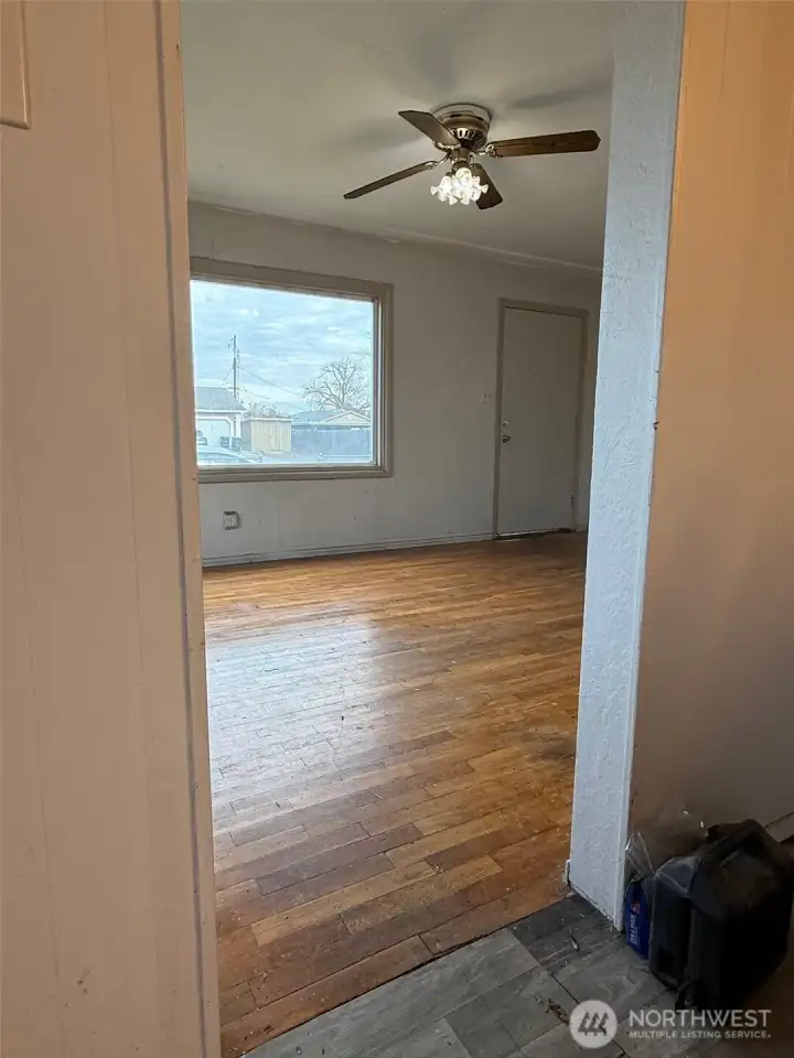 This view is from the kitchen dining area toward the living room and the front of the home.