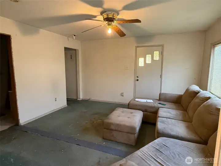 This is a good sized family room.  The entry on the left leads to the half bathroom, laundry room,  and an unique mini type basement area.