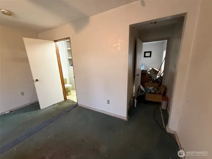 The owner is using the bedroom ahead for items that have been packed for their move.  It has been used as the primary bedroom