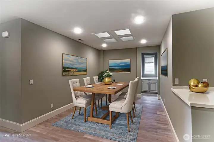 This flex space is centrally located.  Can be used for dining or additional seating area.  Notice the built-in cabinet straight ahead.