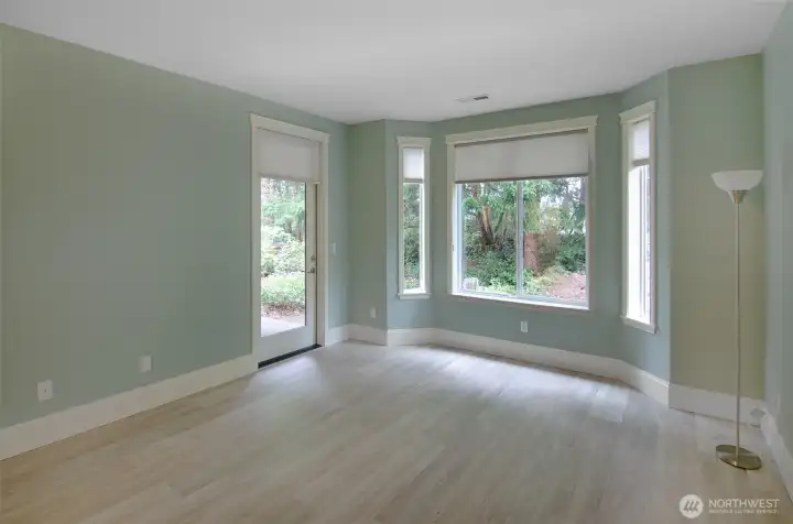 Primary suite overlooks the back yard.  Bay window plus door access to covered back patio.