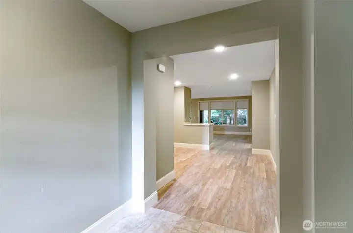 Entry has a wide open space with room for a bench or side table.  Closet is to the right.