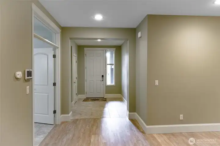 View of entry.  Doors to the left lead to private den.