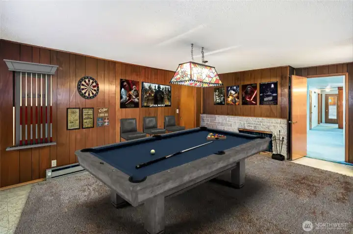 Huge bonus room with sandstone fireplace-staged virtually.