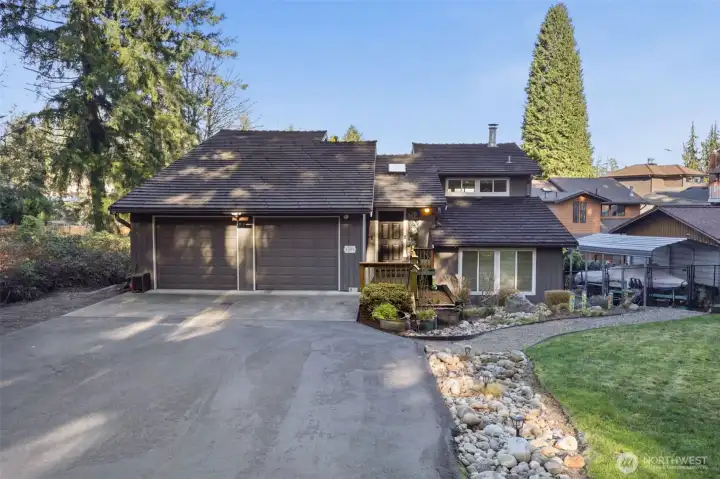 Drive up to this beautifully maintained Lake Front Home with plenty of space to run around or bring your gardening ideas to life