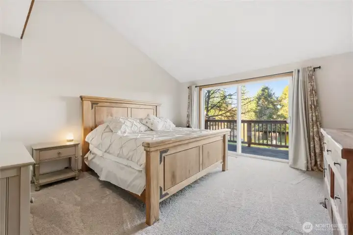 walking down the hall you walk into the main bedroom with a walk in closet with an en suite and a private balcony overlooking the lake