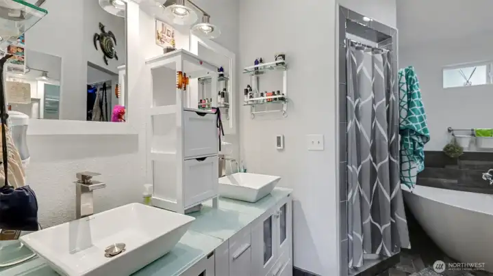 A bright, spa-inspired primary bath with sleek design