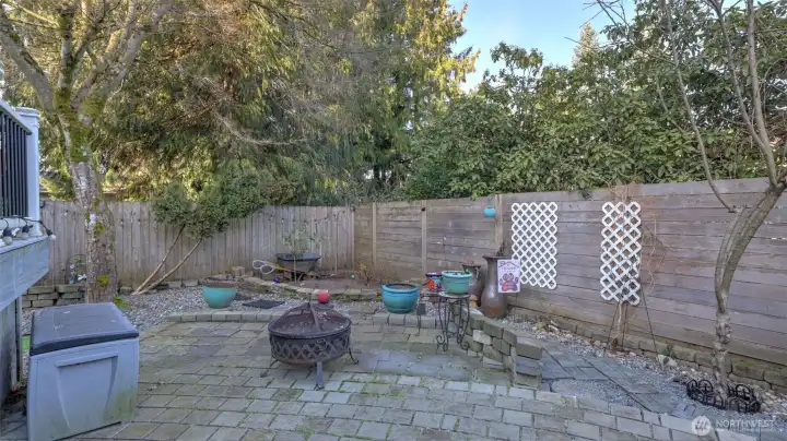 A peaceful backyard retreat with firepit